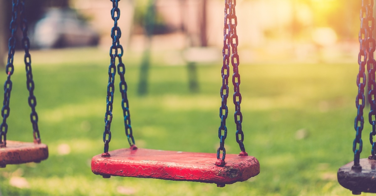 Empty chain swing in children playground