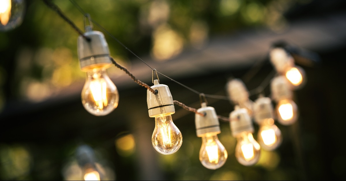 outdoor string lights hanging on a line in backyard