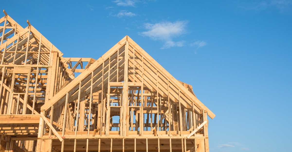 gables roof on stick built home under construction and blue sky