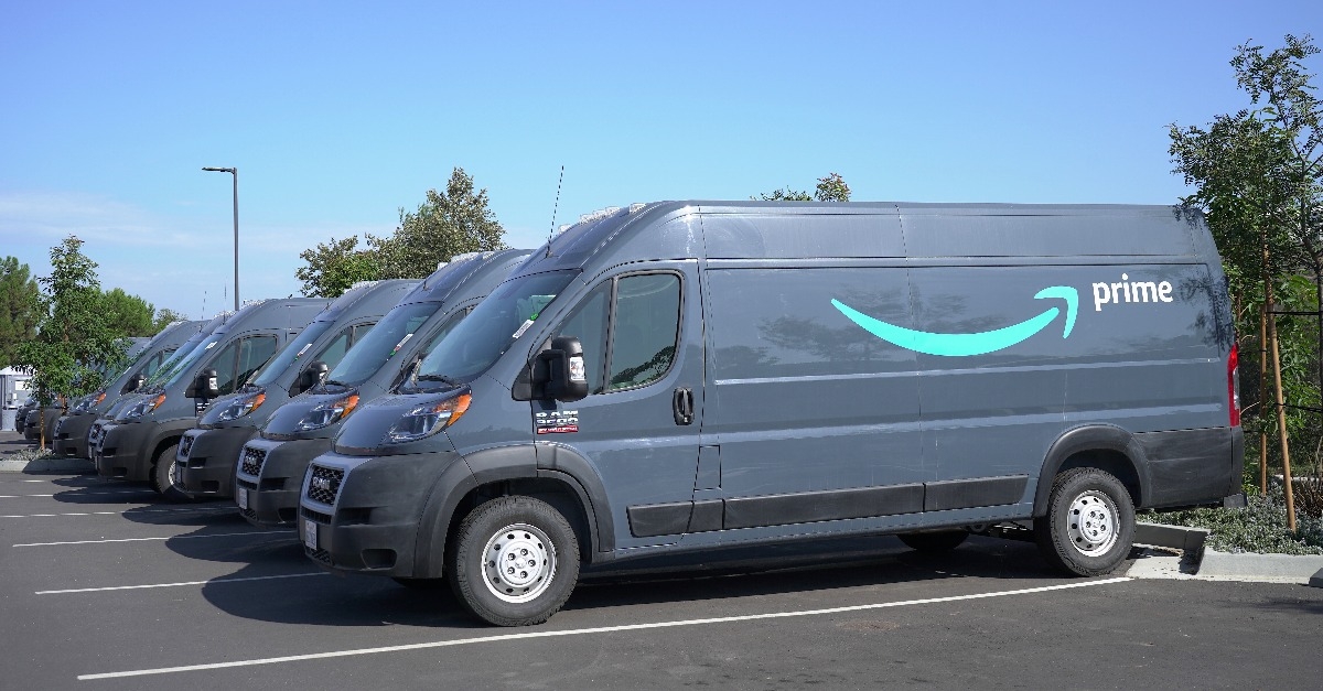 Parked rows of Amazon Prime delivery vans