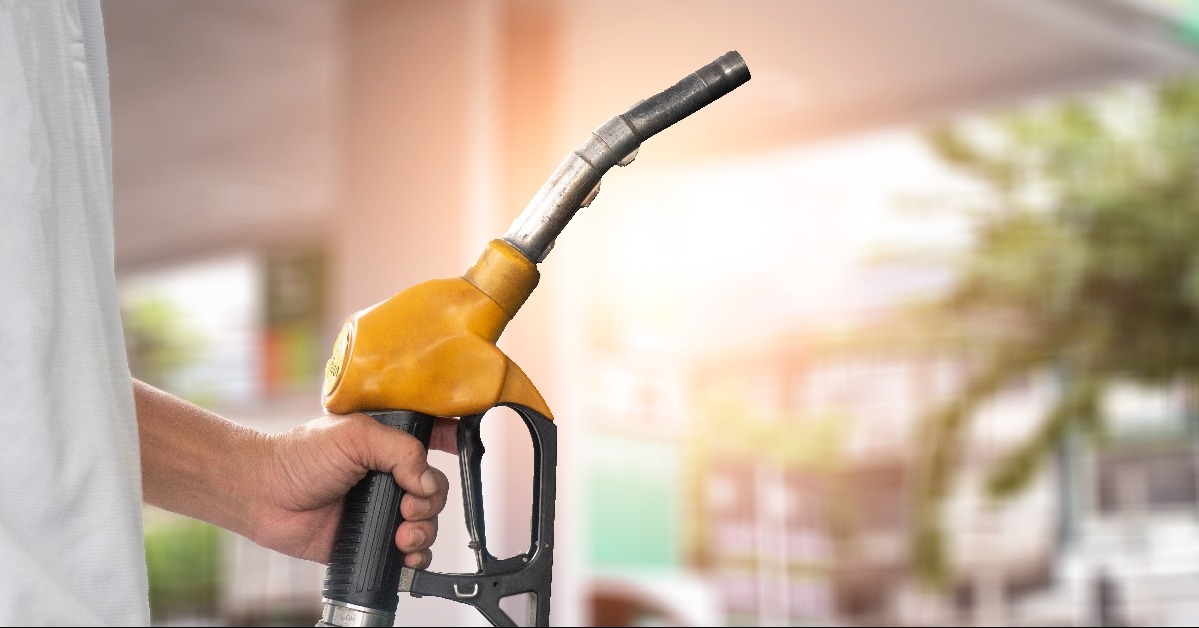 hand holding fuel nozzle