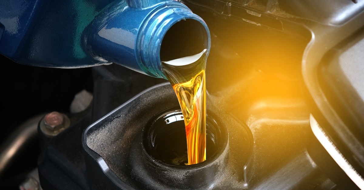 refueling and pouring oil quality into the engine motor car