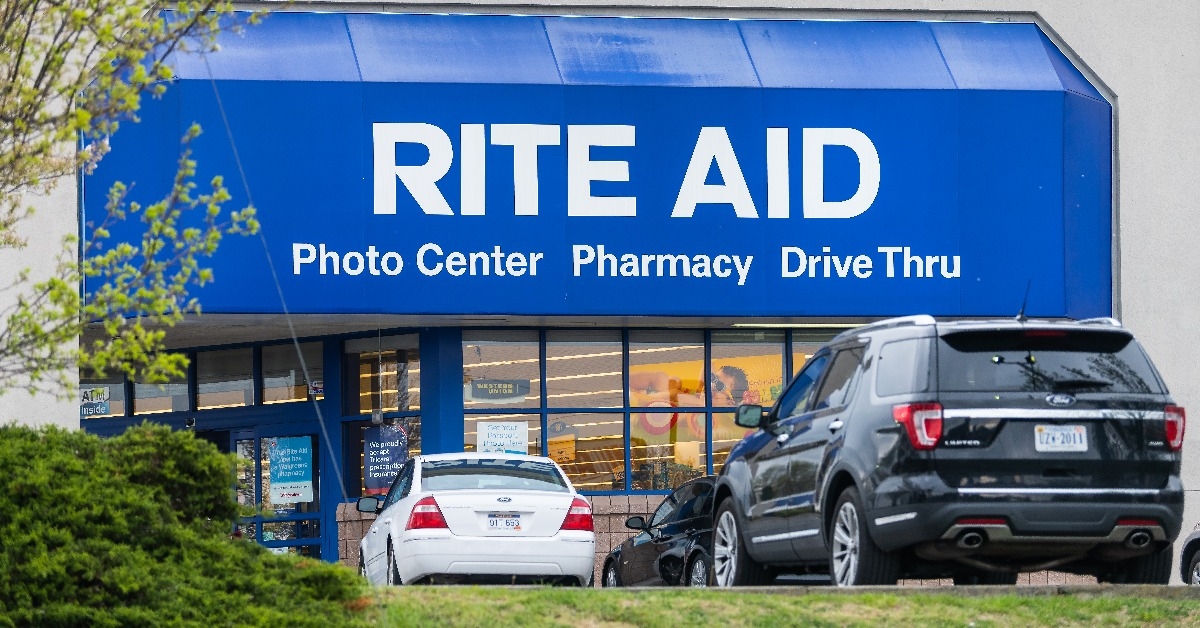 road street during day in city with Rite Aid pharmacy store