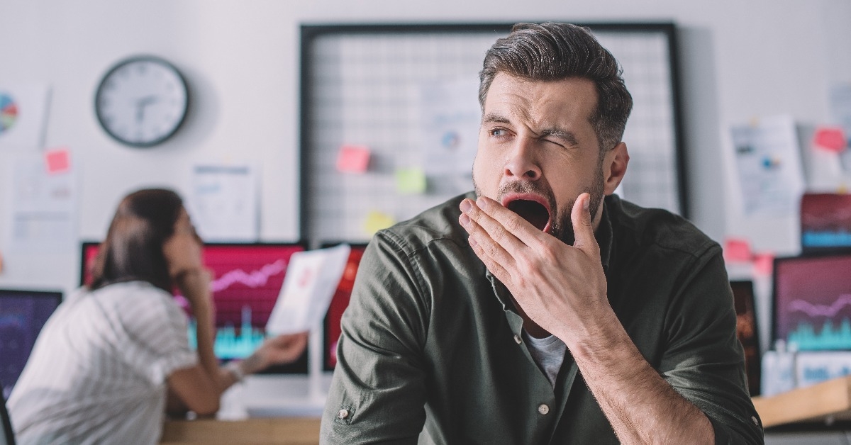 data analyst yawning in office