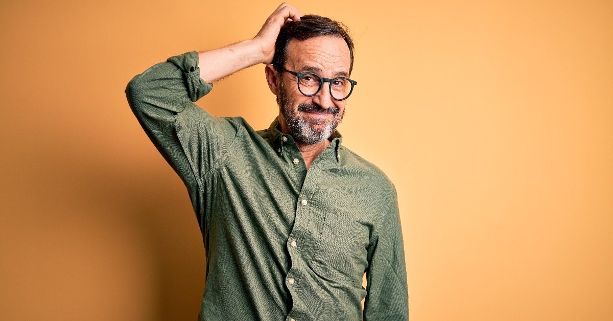 man wearing casual green shirt and glasses 