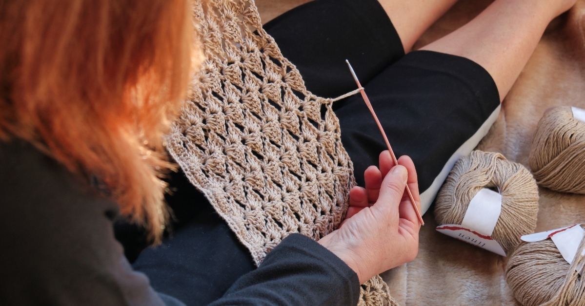 woman crocheting a natural linen pattern 