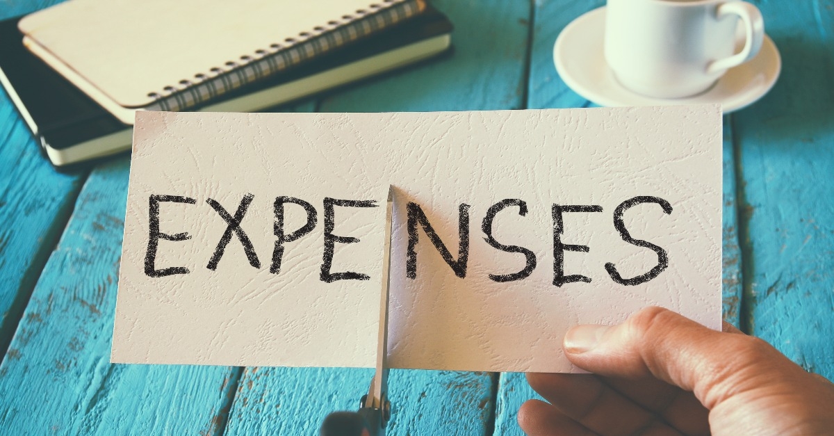 holding card with expenses word