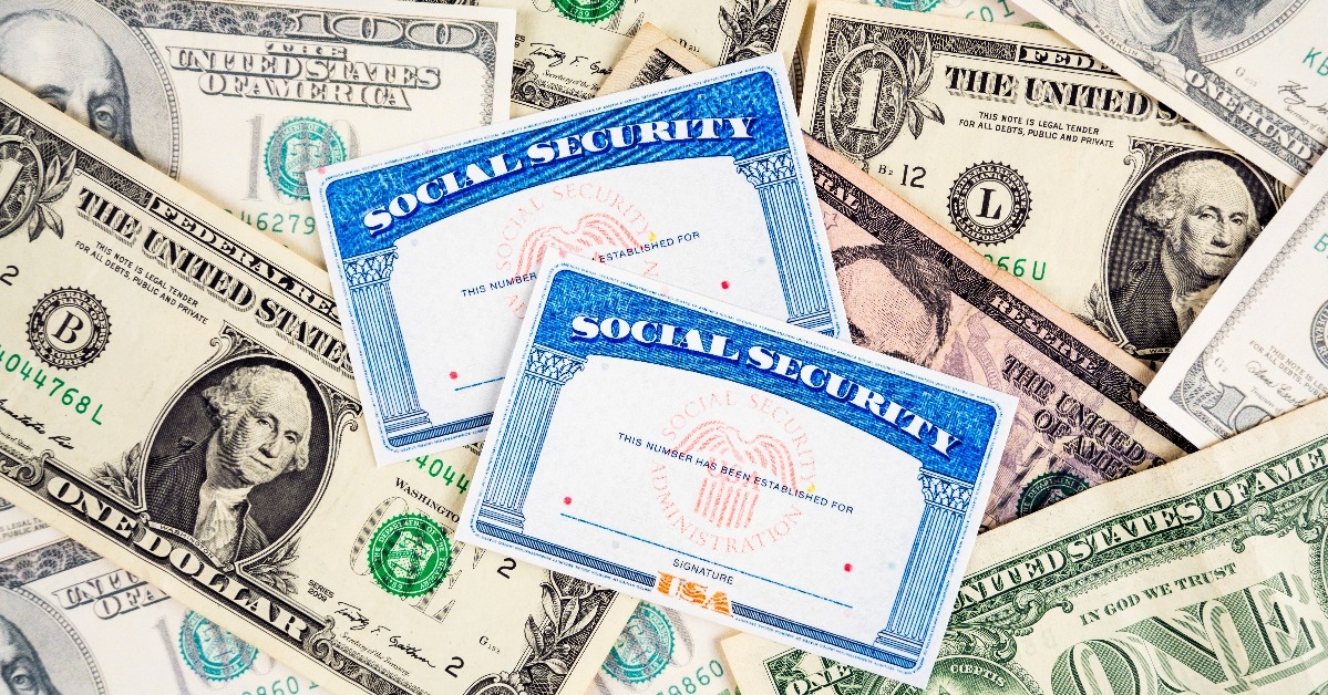 US social security cards and dollar bills