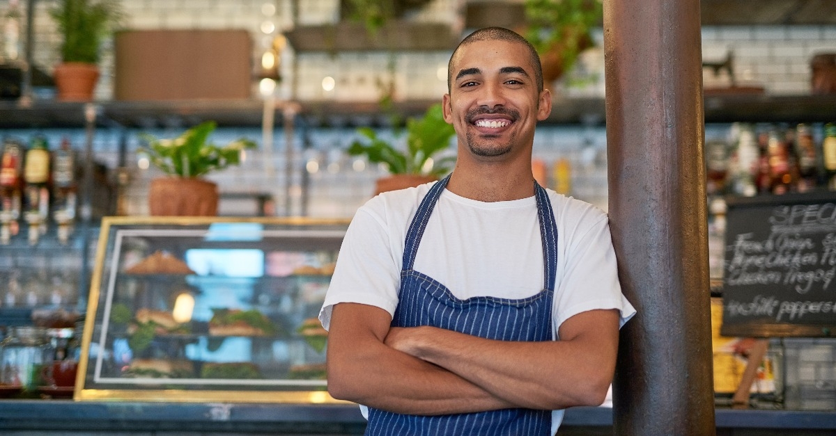 young entrepreneur standing in his business