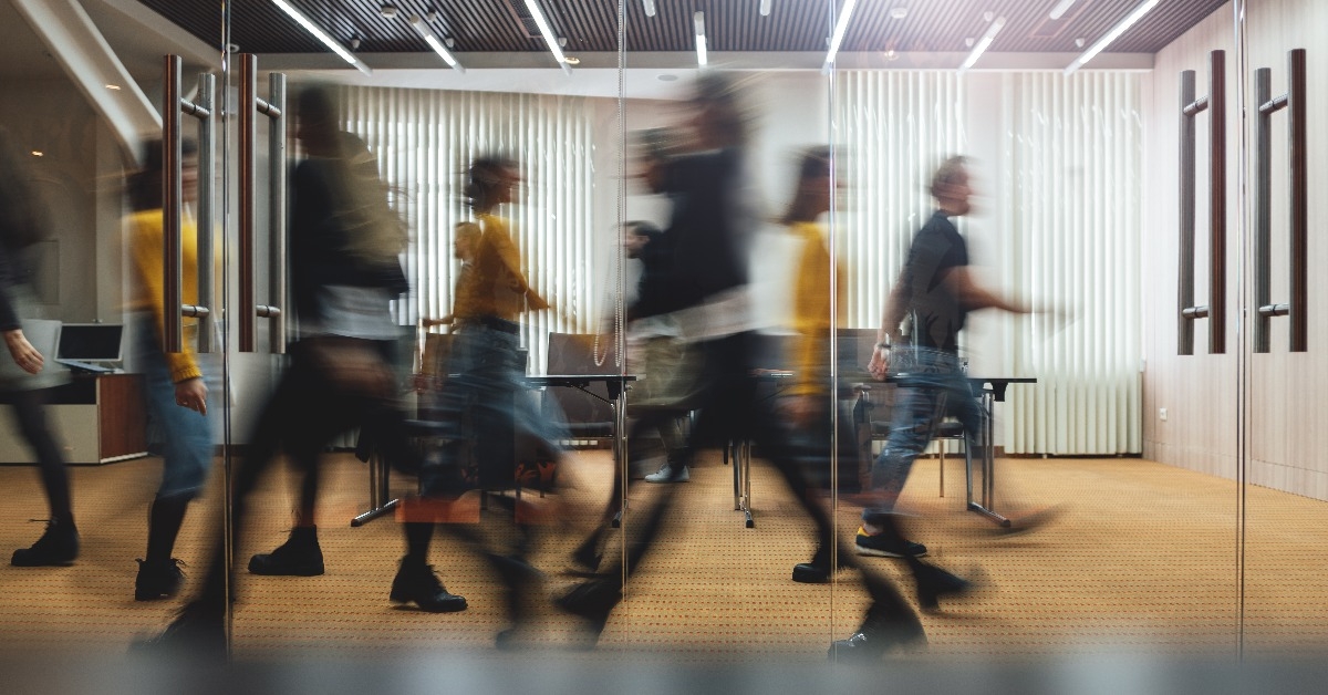 businesspeople walking at modern office