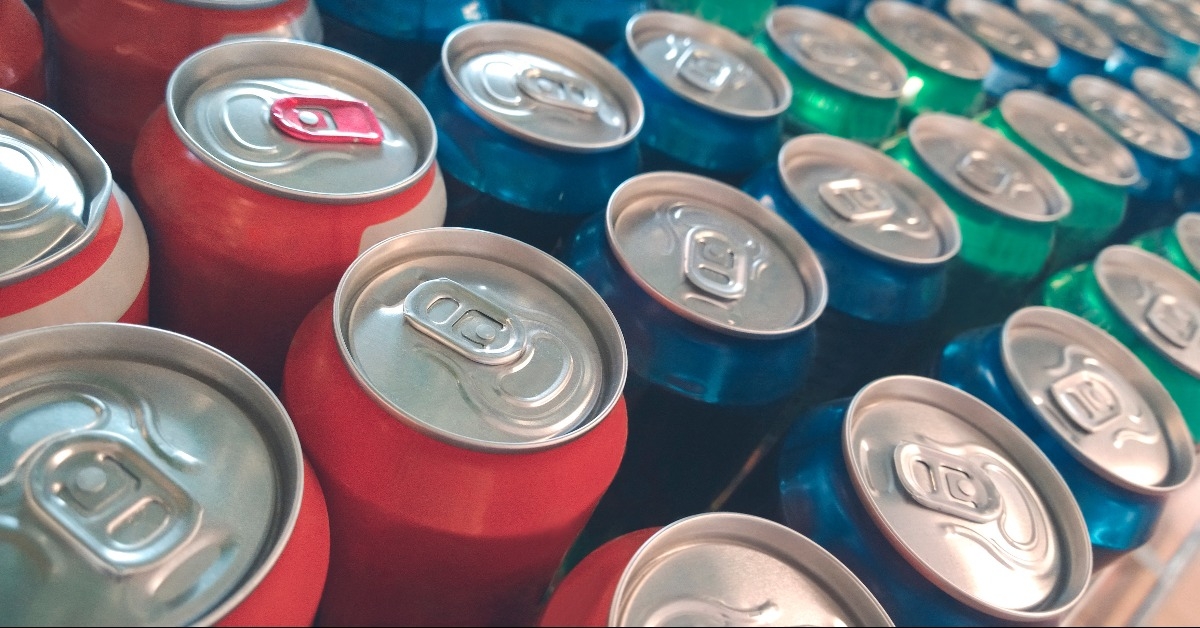 colorful metal cans with soda drink