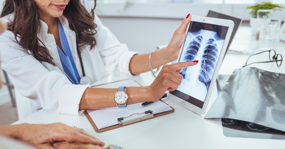 doctor showing  x-ray scan chest on digital tablet screen