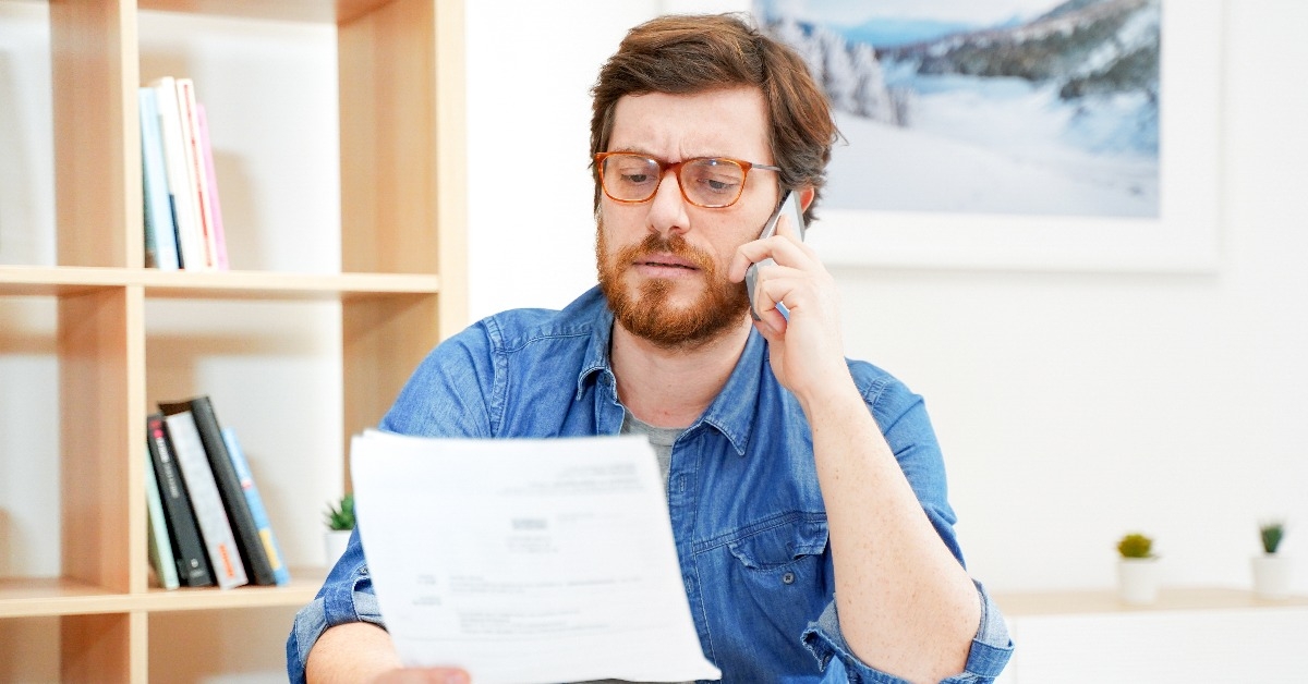man calling customer service after unjustified costs complain 
