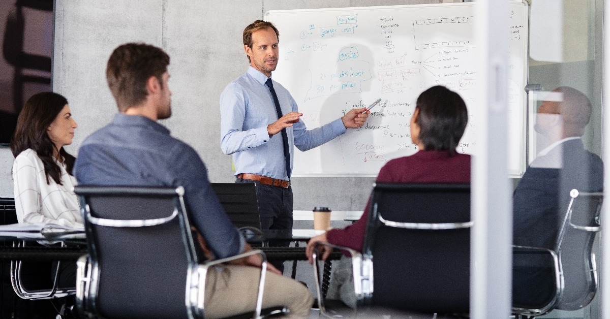 businessman giving presentation with colleagues