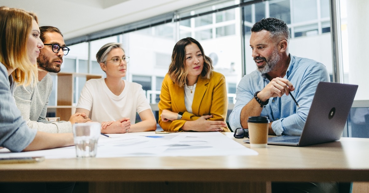 group of multicultural designers having a meeting in an office