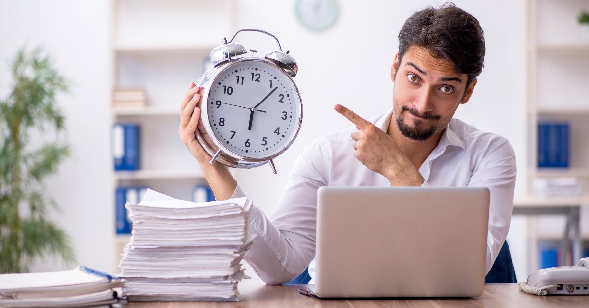 young male employee in time management