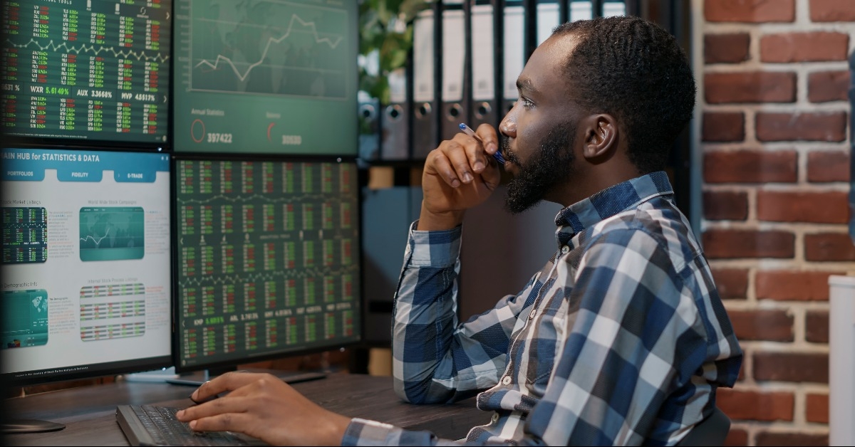 male investor brainstorming ideas to create stock trading profit 