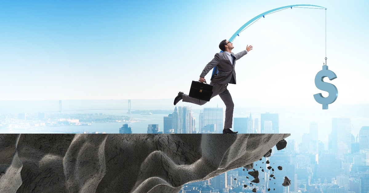 businessman chasing money on fishing rod 