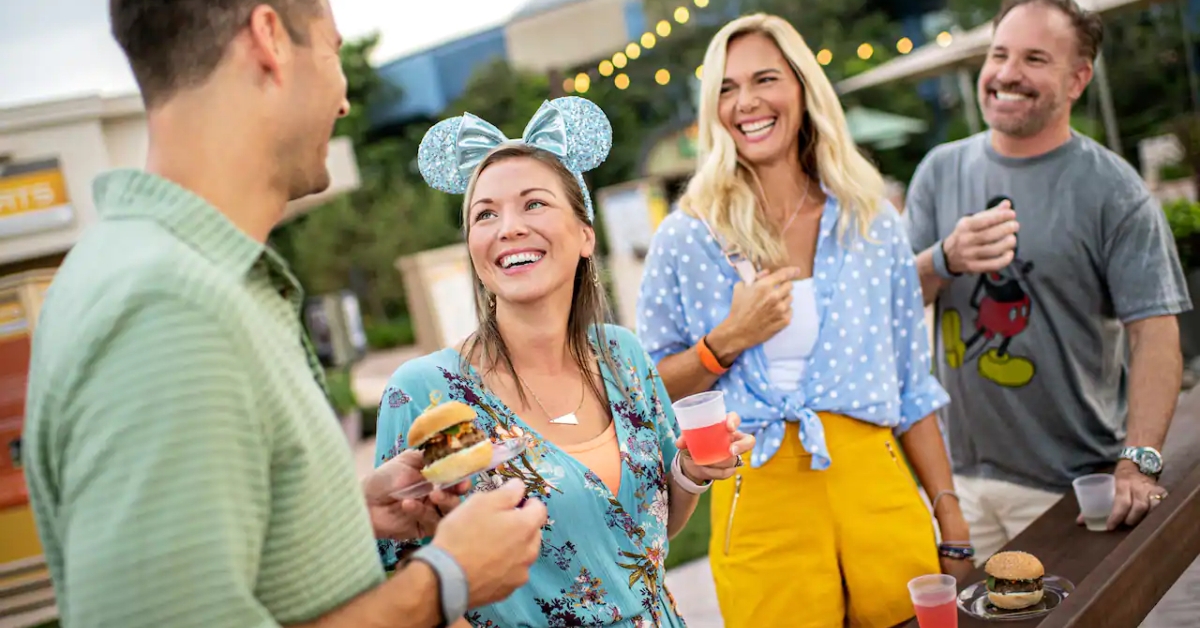 Friends drinking and eating at Disney