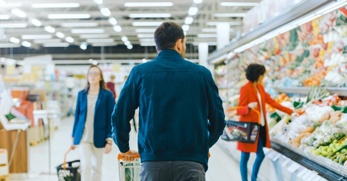 People grocery shopping at the supermarket
