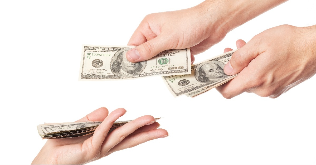 hands giving money