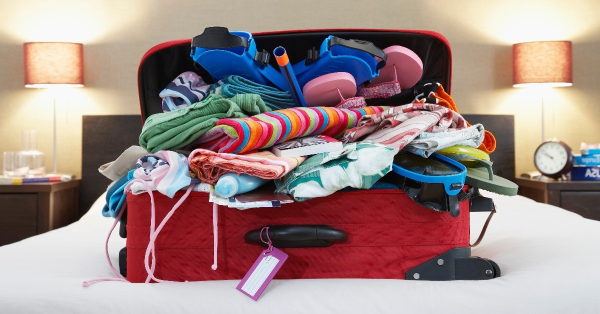 open suitcase on bed