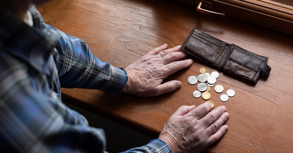 old man counting money