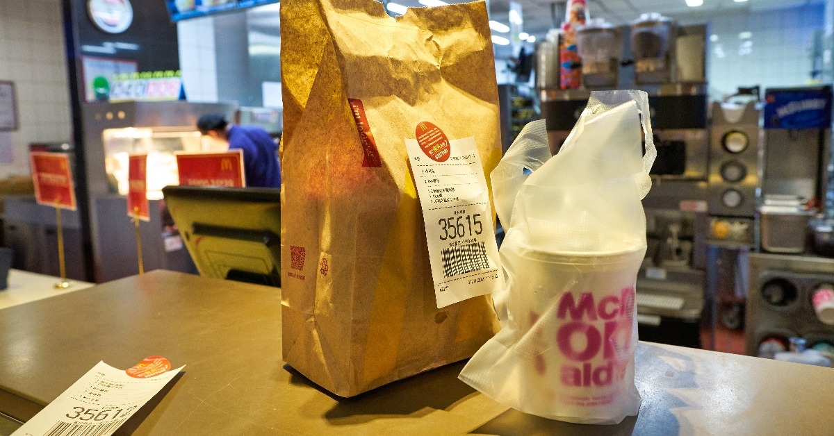 food served in a paper bag on counter at McDonald's restaurant 
