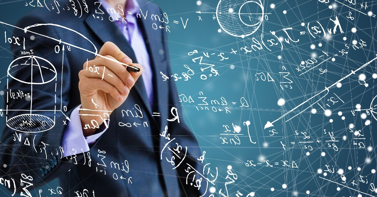 man writing math formulas on the screen