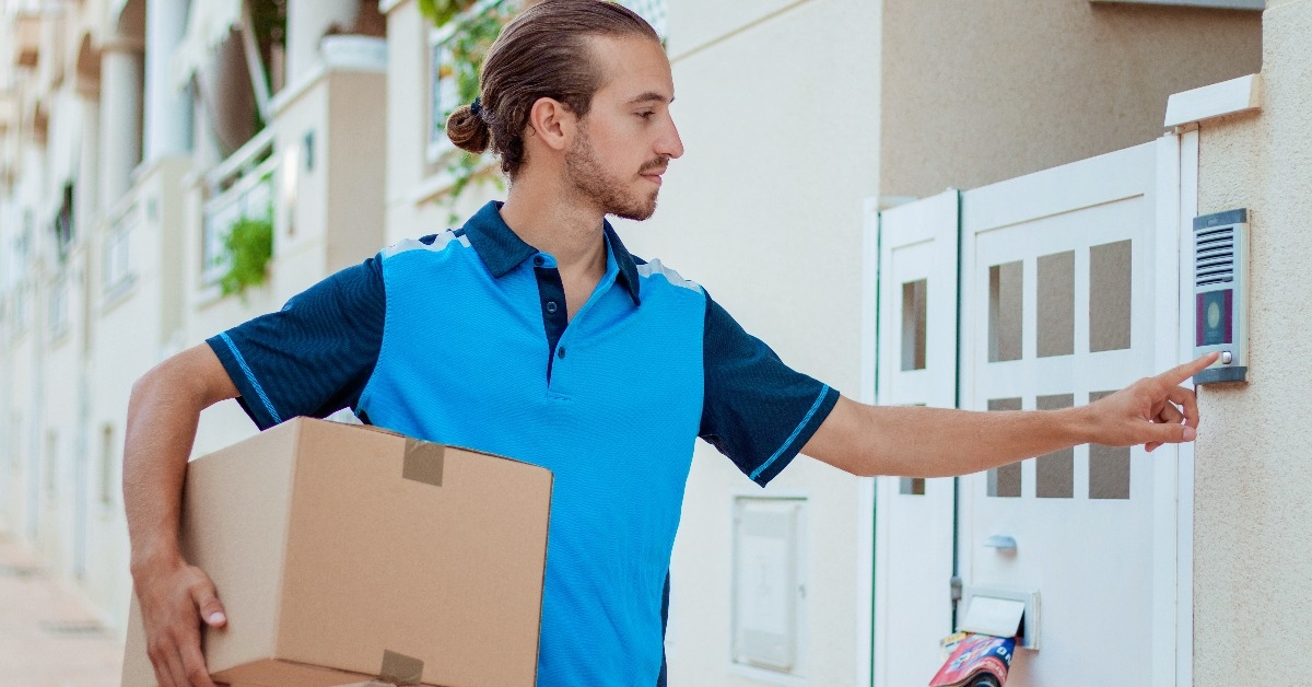 delivery man ringing the doorbell
