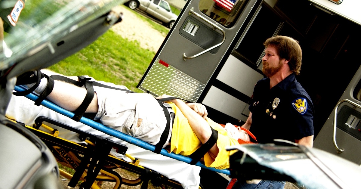 EMTs loading patient into ambulance