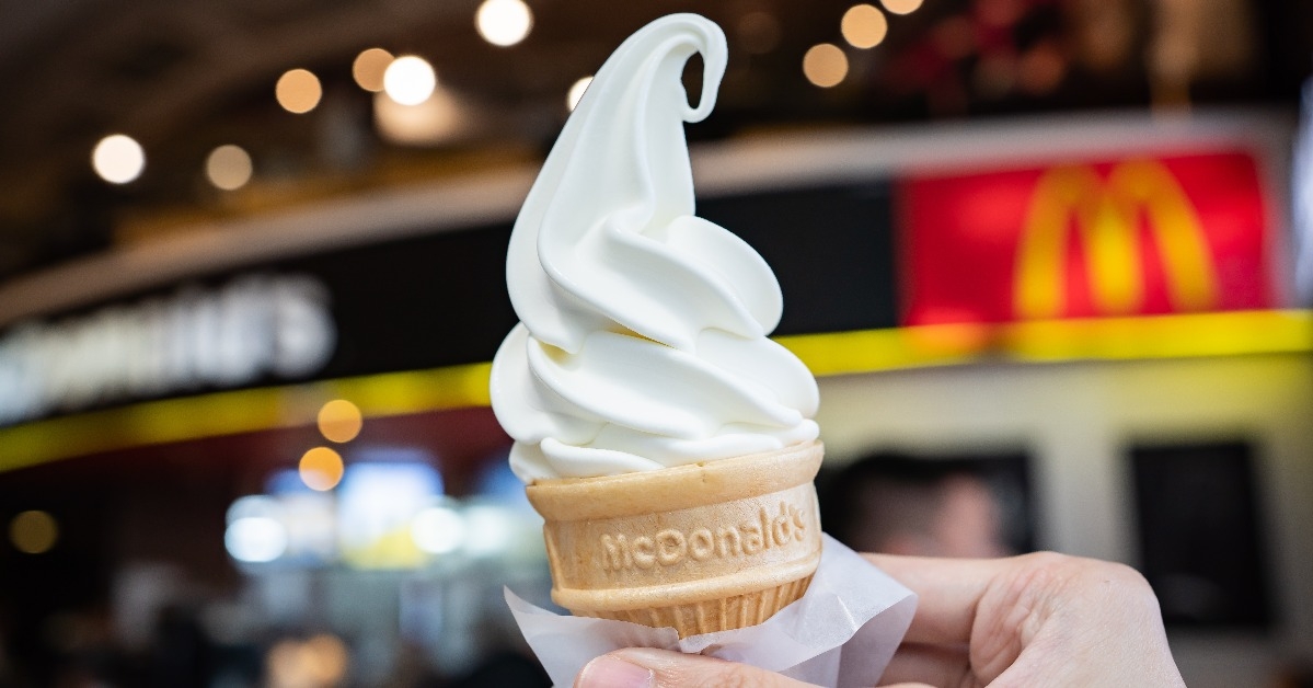 man holding McDonald's vanilla cone 