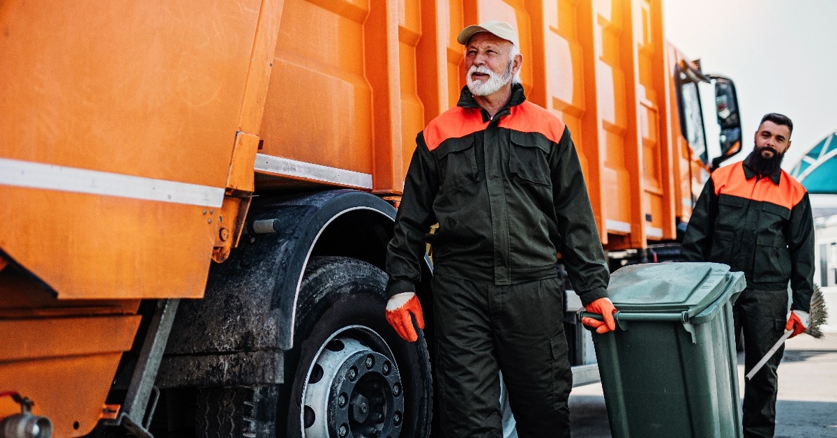 garbage men working together on emptying dustbins for trash removal