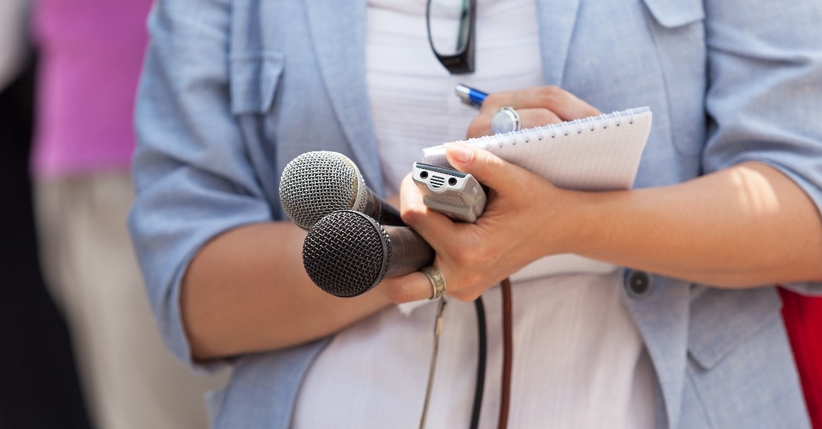 journalist taking down notes