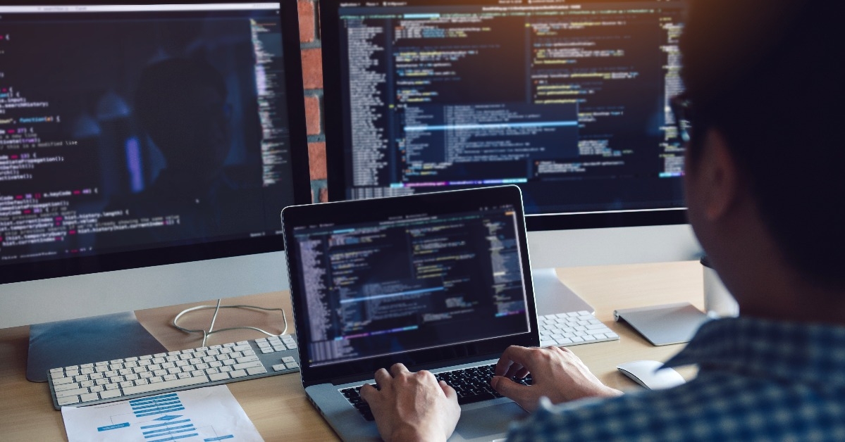 software developer analyzing data on the computer screen