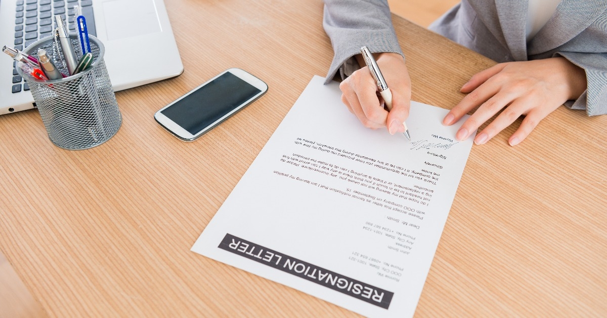 office worker writing resignation letter