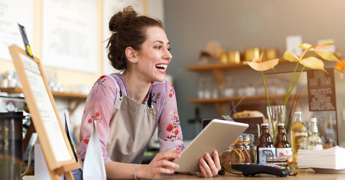 woman using digital tablet in coffee shop