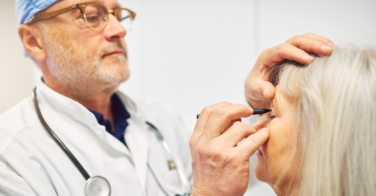 doctor drawing with marker on adult patient face