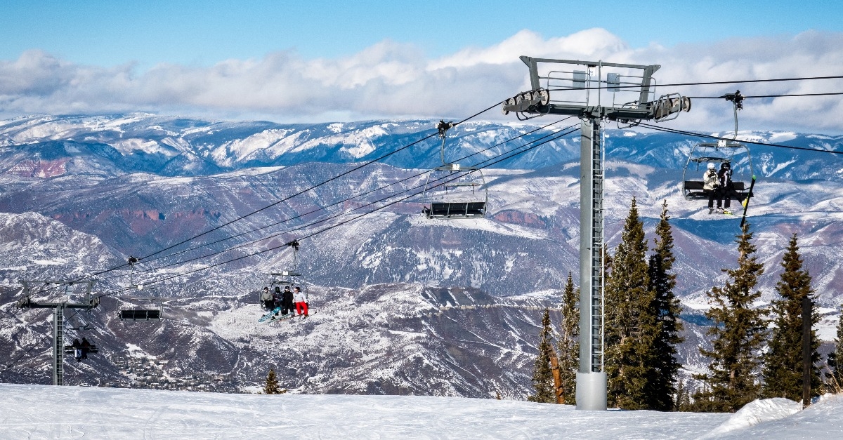 skiers and snowboarders ascend the Elk Camp