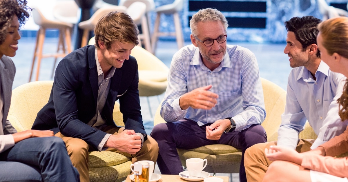 colleagues having a discussion in cafeteria