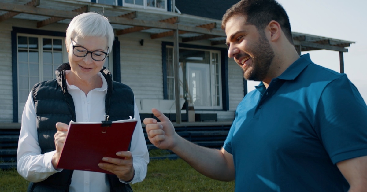 old woman signing documents