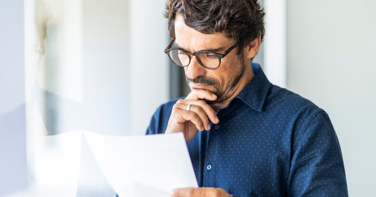 man reading a document