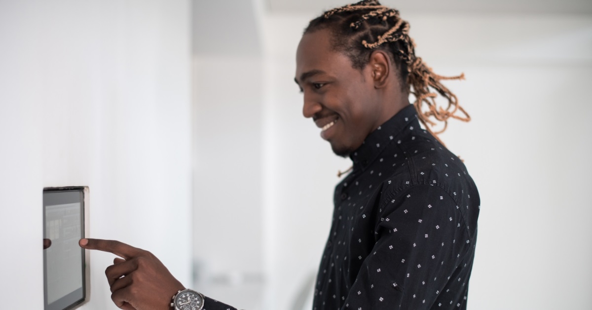 young man using smart home screen