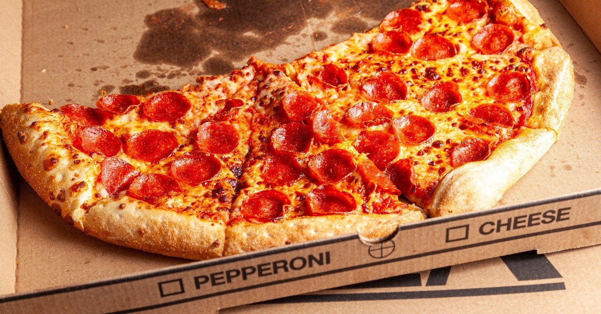  fresh made pepperoni pizza sliced and placed in cardboard box