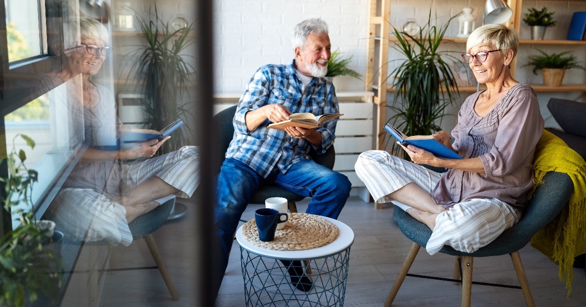 senior couple reading books at home