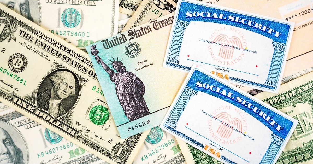 social security cards stimulus check and dollar bills