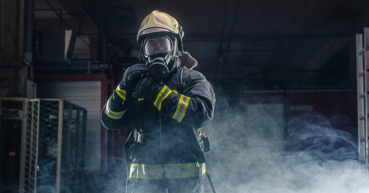 fireman wearing firefighter turnouts and helmet
