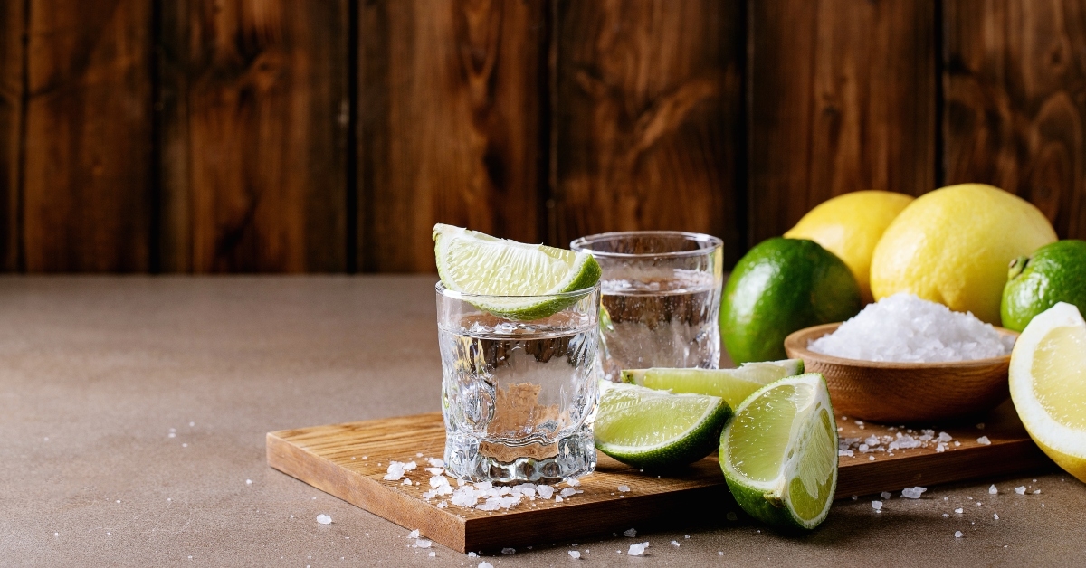 White tequila shots with lime