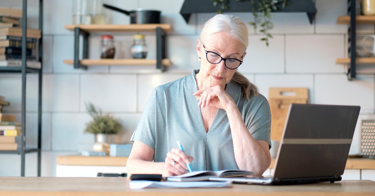 senior woman using laptop for websurfing