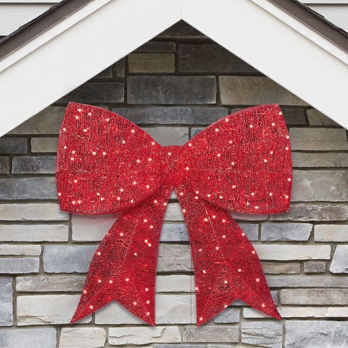 Huge red bow outdoors house Christmas decoration with LED lights